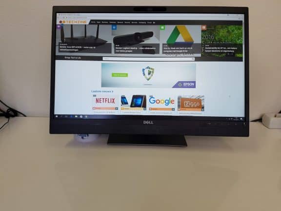 Een Dell XPS 15 pc op een bureau met een webbrowser, aangesloten op een Dell P2418hz monitor.