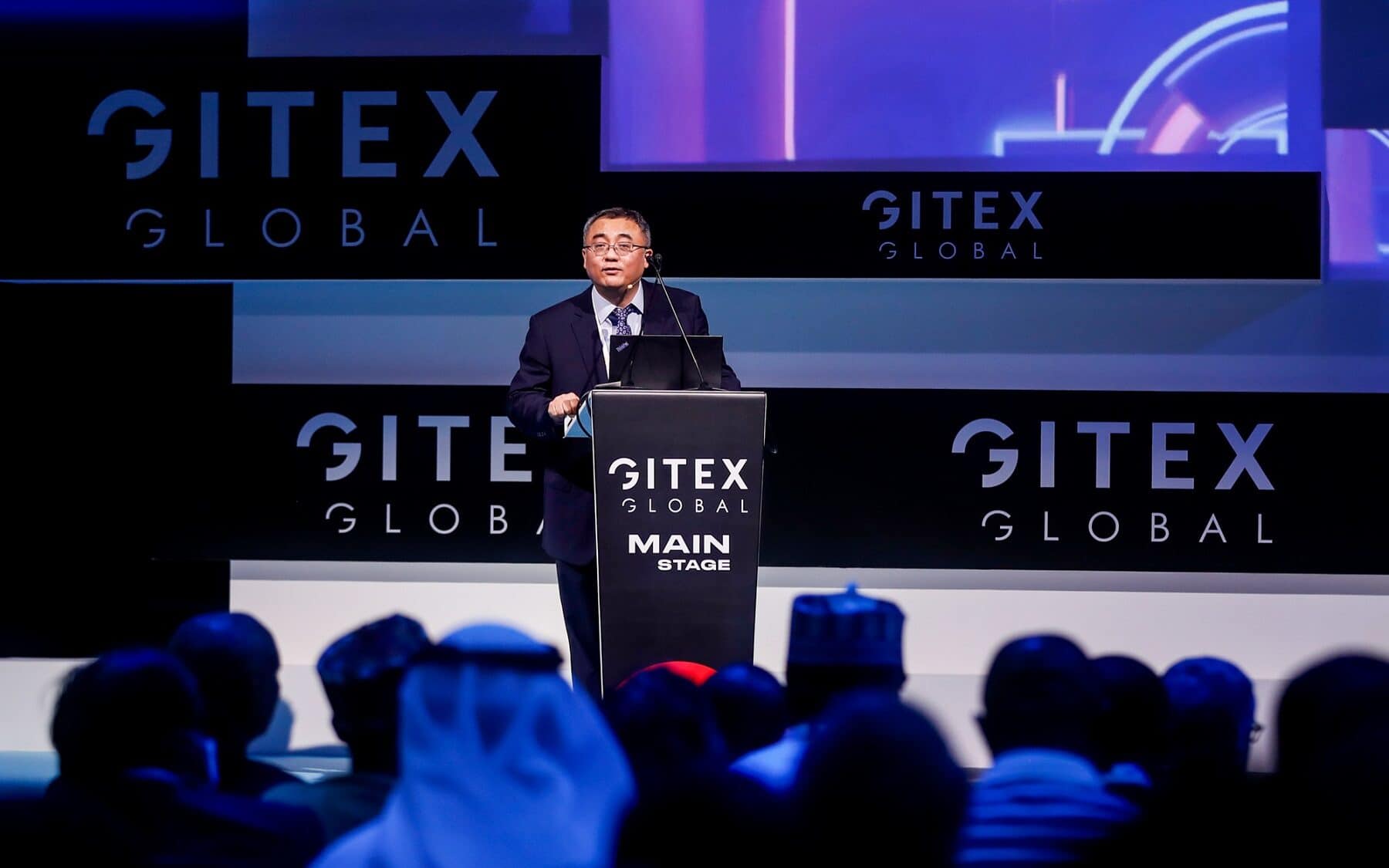 Dr.-Tian-Qi-Chief-AI-Scientist-Huawei-Cloud-at-GITEX-Main-Stage-on-Day-1 Dr.-Tian-Qi-Chief-AI-Scientist-Huawei-Cloud-at-GITEX-Main-Stage-on-Day-1